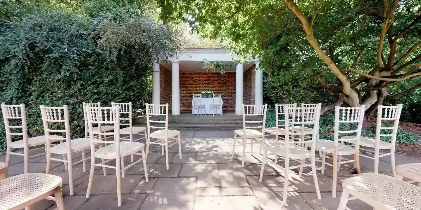 White chairs arranged on a patio.