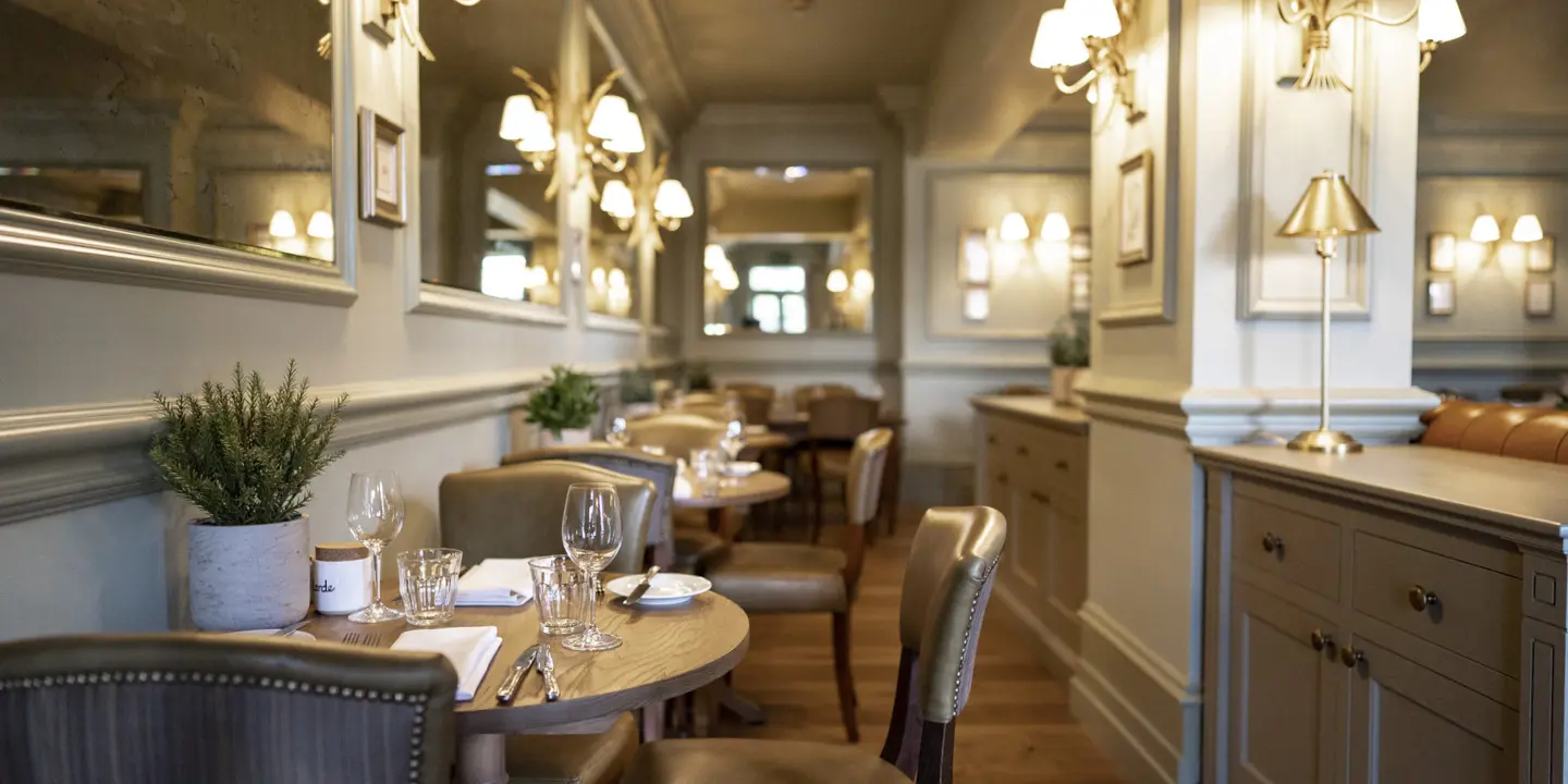 A spacious dining room filled with numerous tables and chairs.