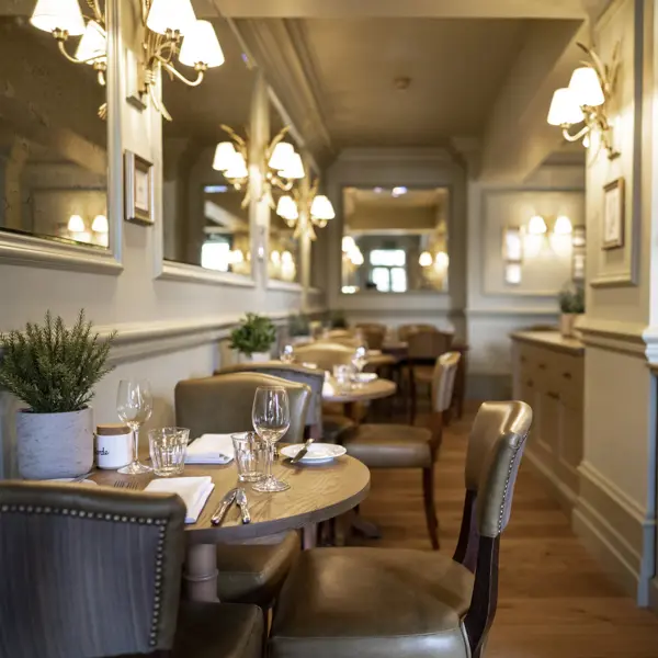 A spacious dining room filled with numerous tables and chairs.
