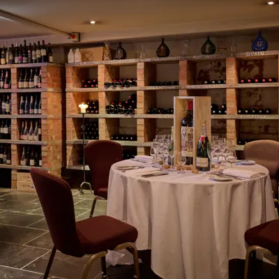 A wine tasting cellar with one assorted table