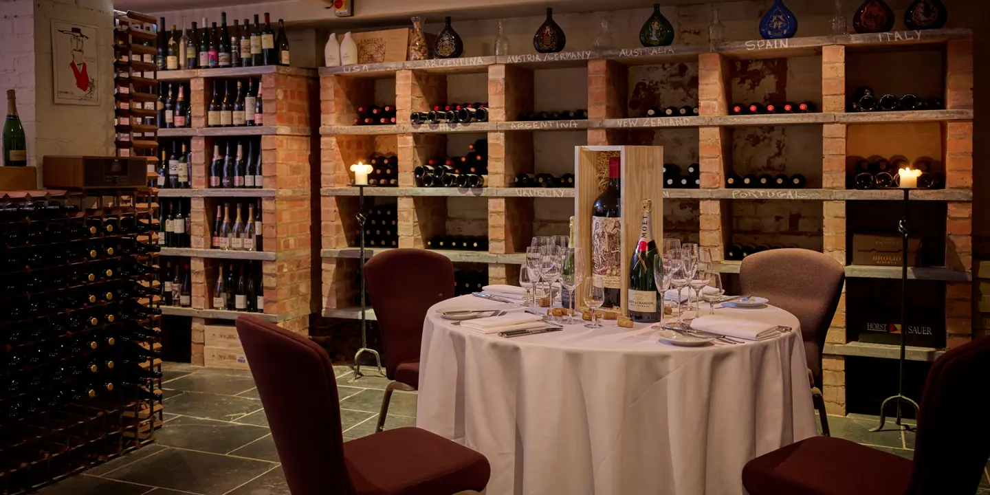 A wine tasting cellar with one assorted table
