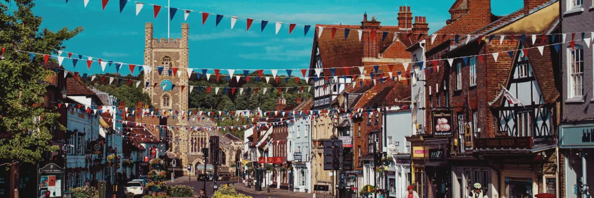 City street with clock tower in the background.