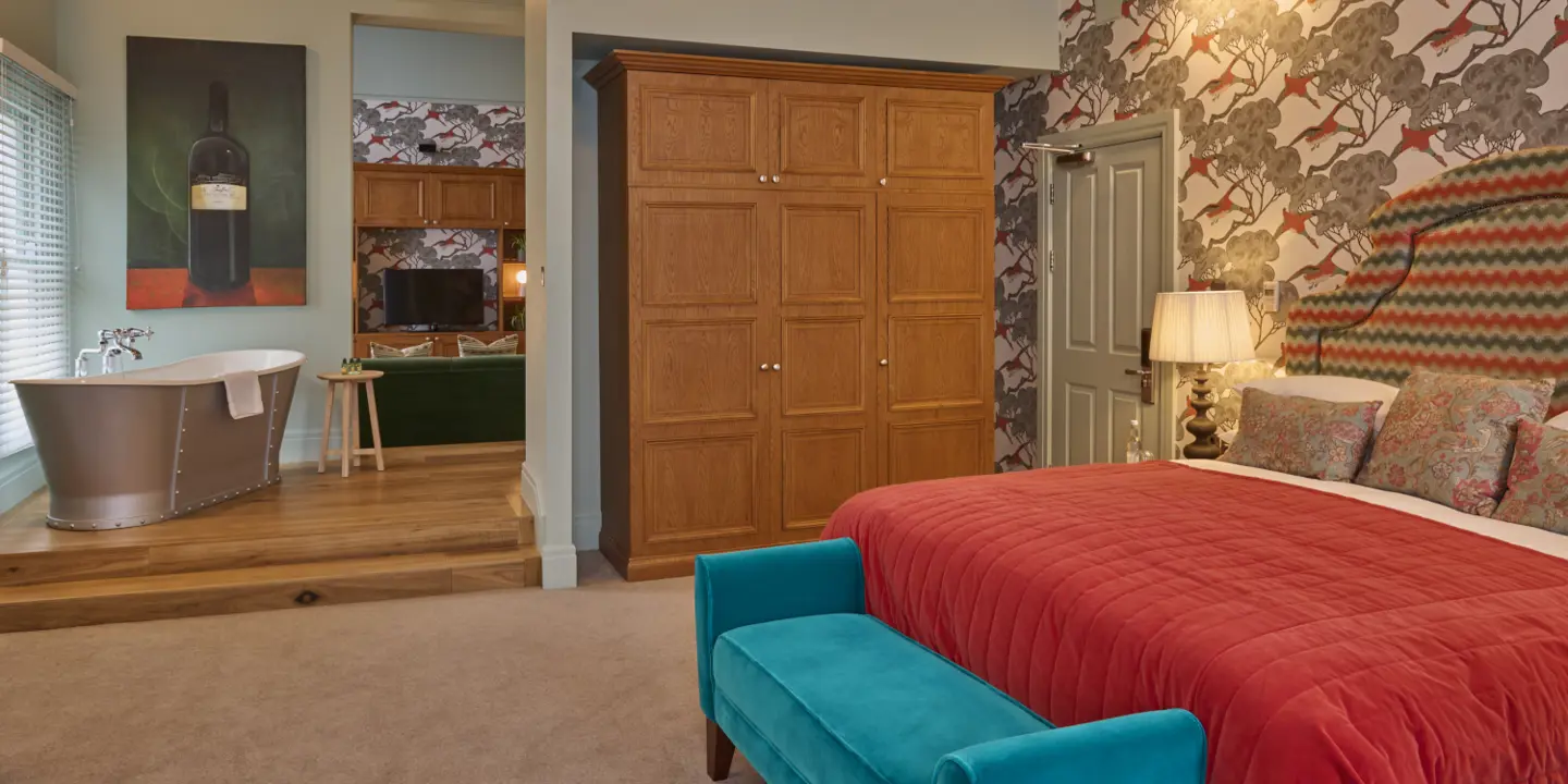 A bedroom decorated with blue and red furniture 
