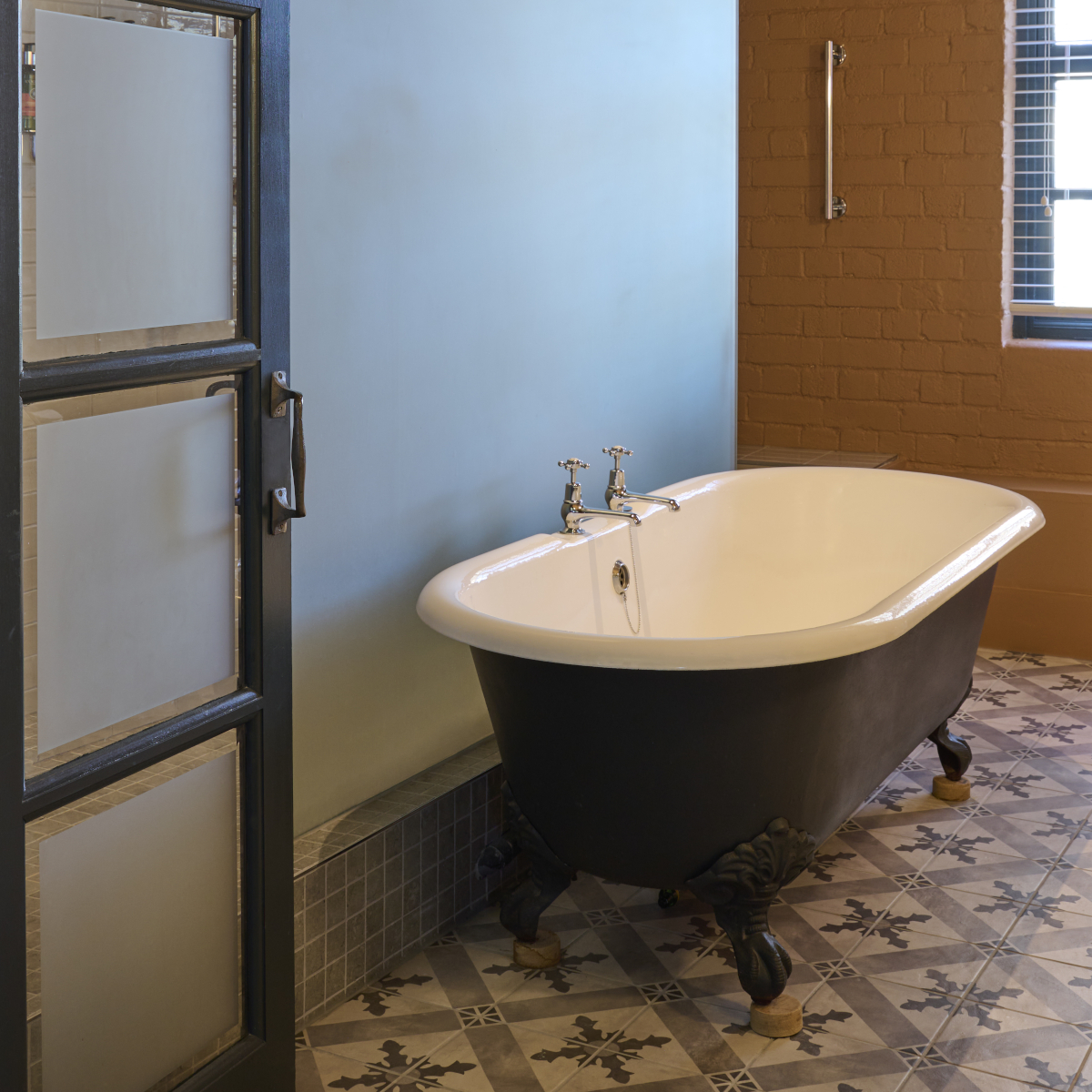 Bathroom featuring a bathtub and toilet