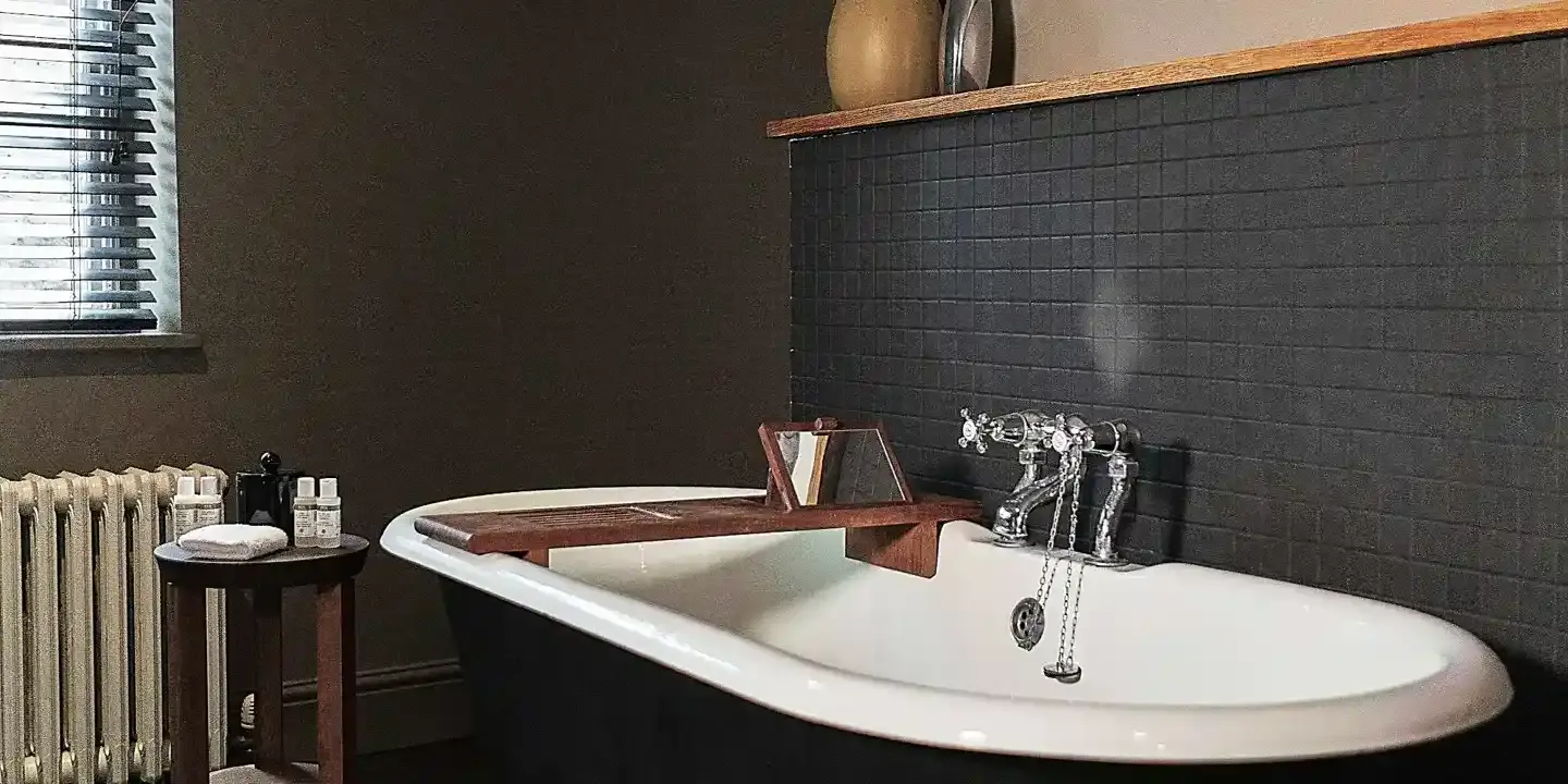 Bathroom featuring a bathtub and radiator.