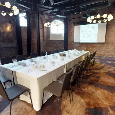 A long table arranged in a spacious room.