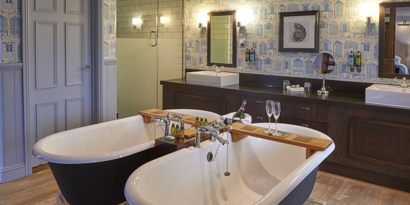 Bathroom featuring two sinks and a bathtub