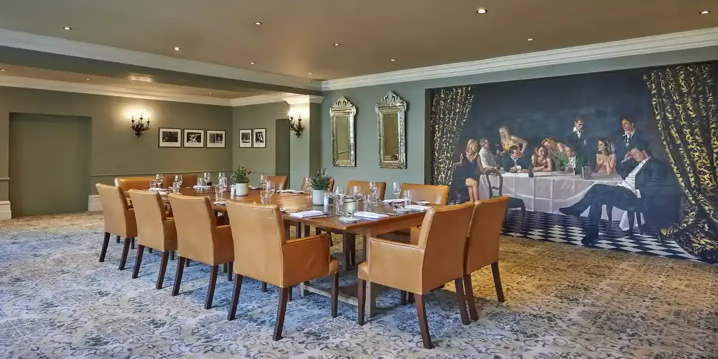 Dining room featuring a prominent wall painting.