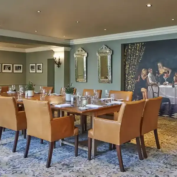 Dining room featuring a prominent wall painting.