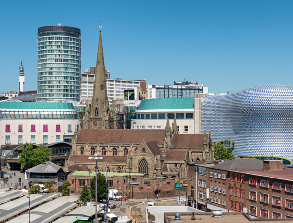Cityscape featuring a church in the background.