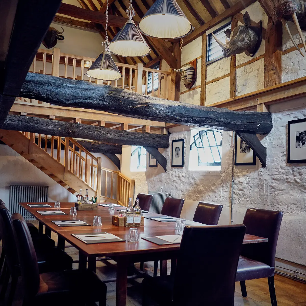 A dining room featuring a wooden table and chairs.