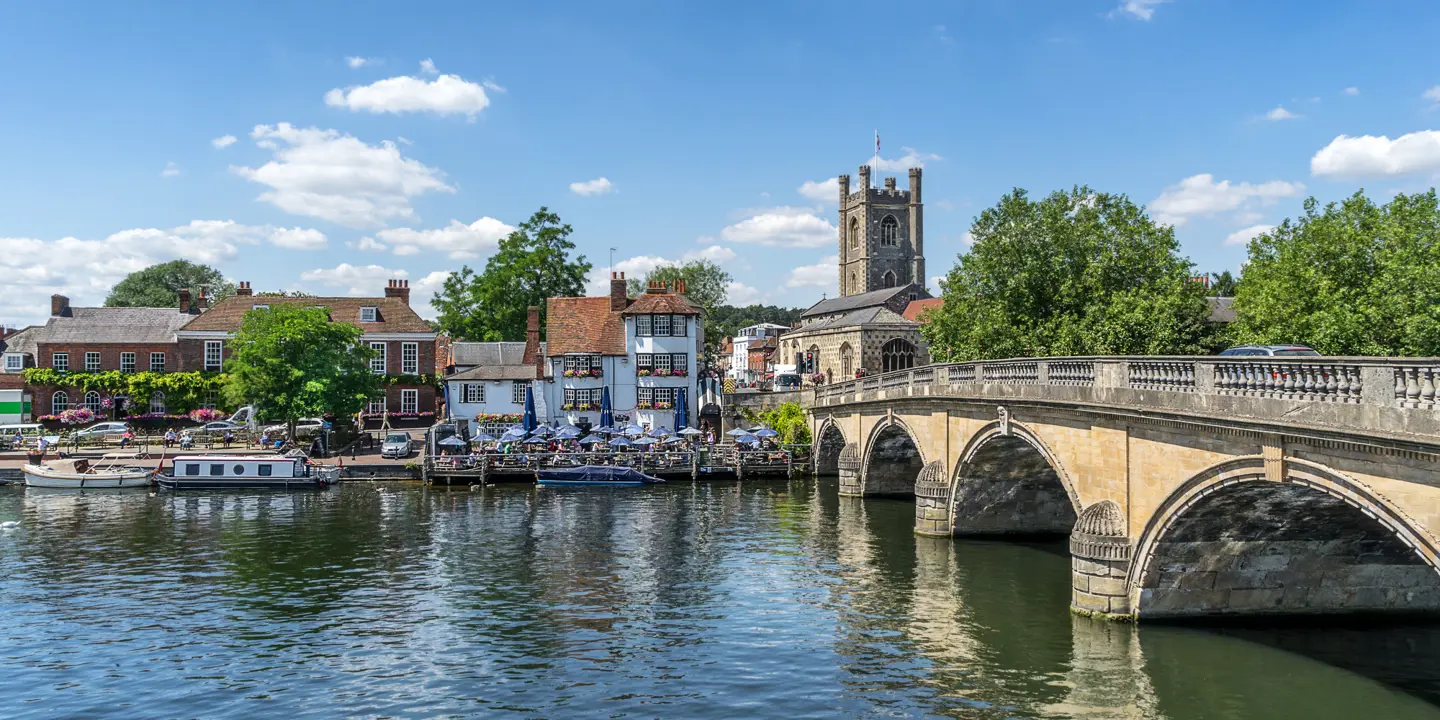 Henley Bridge spanning a body of water with buildings in the background.