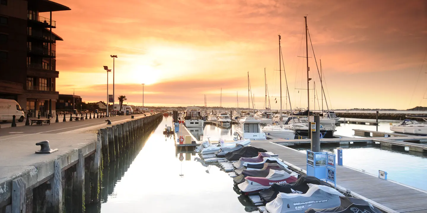 A cluster of boats moored at a dock.