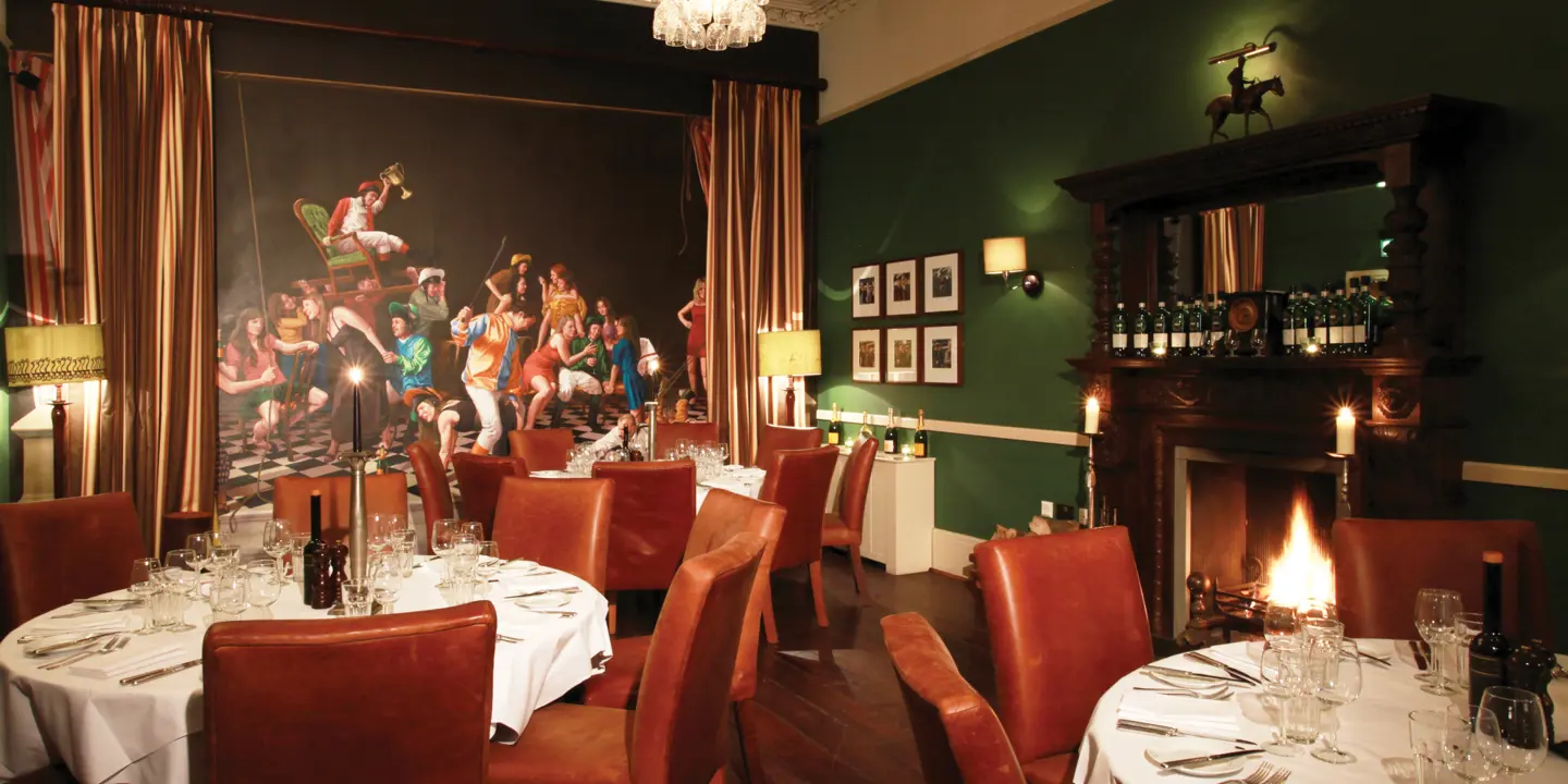 Dining room featuring a prominent wall painting.