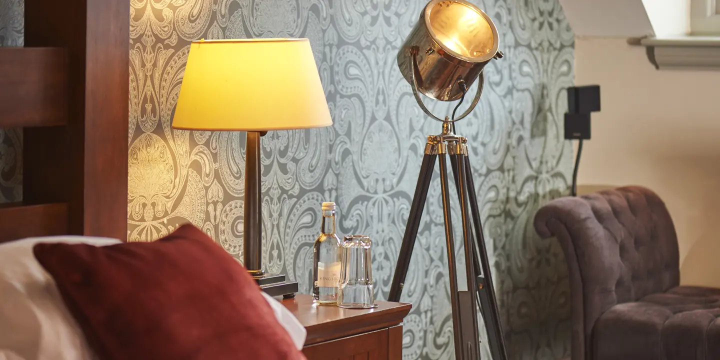 Bedroom featuring a lamp and chair.