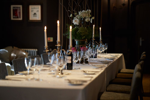 Candlelit table set for a fine dining experience.