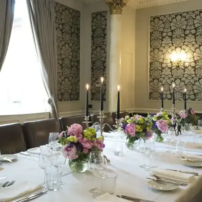 HDV Poole Private Dinine with candle holders and pink flowers on a table (2)