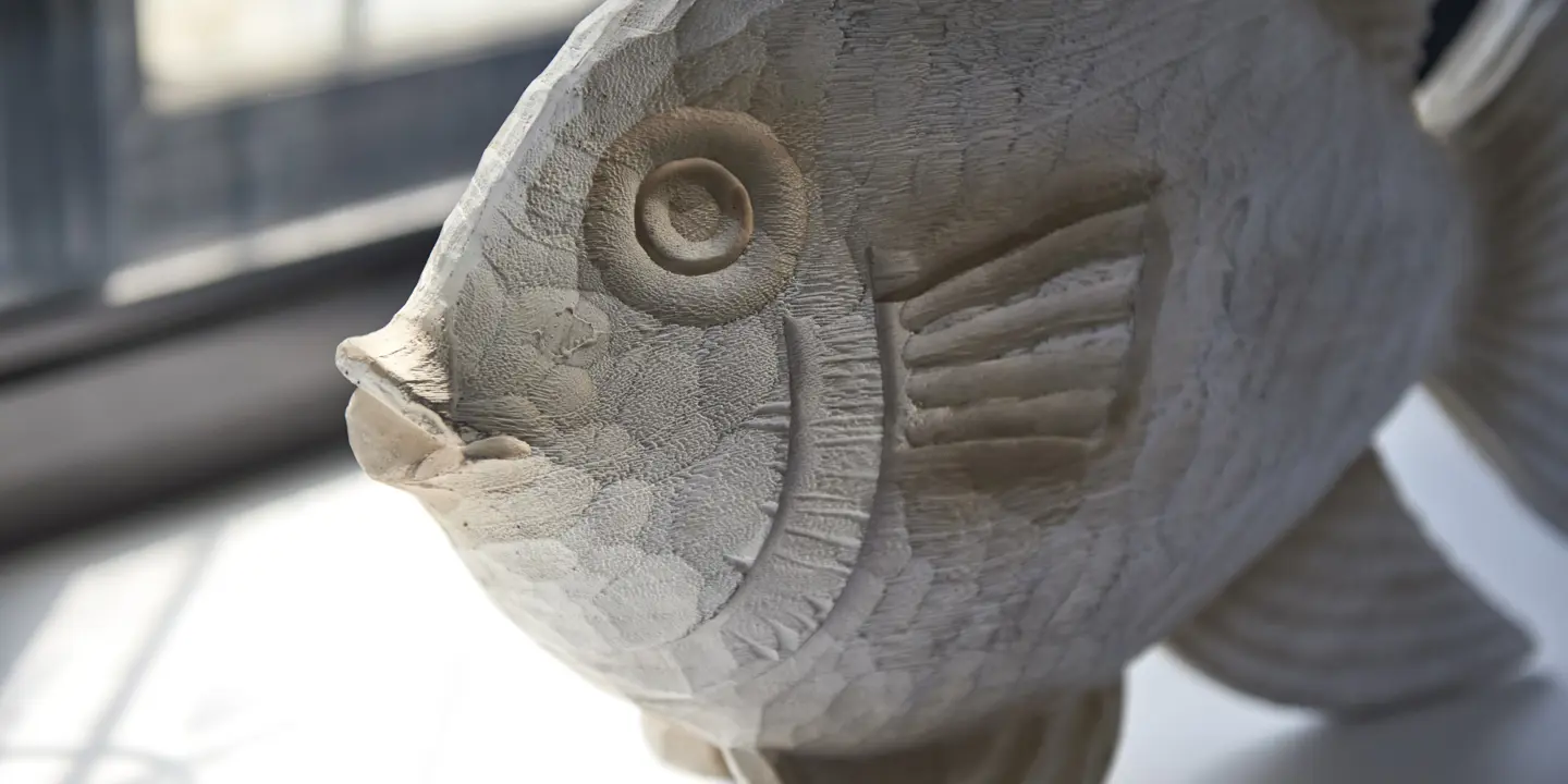 Close-up of a fish statue.