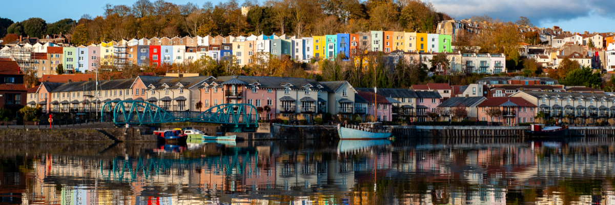 A beautiful view of coloured houses across a body of water
