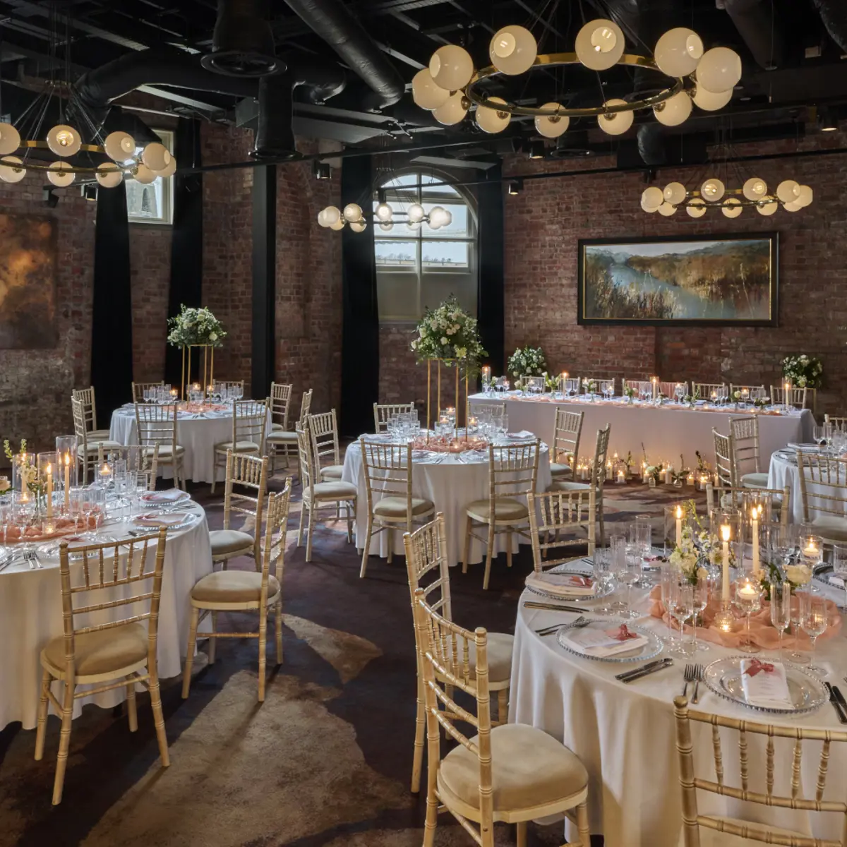 A spacious room with neatly arranged tables and chairs.