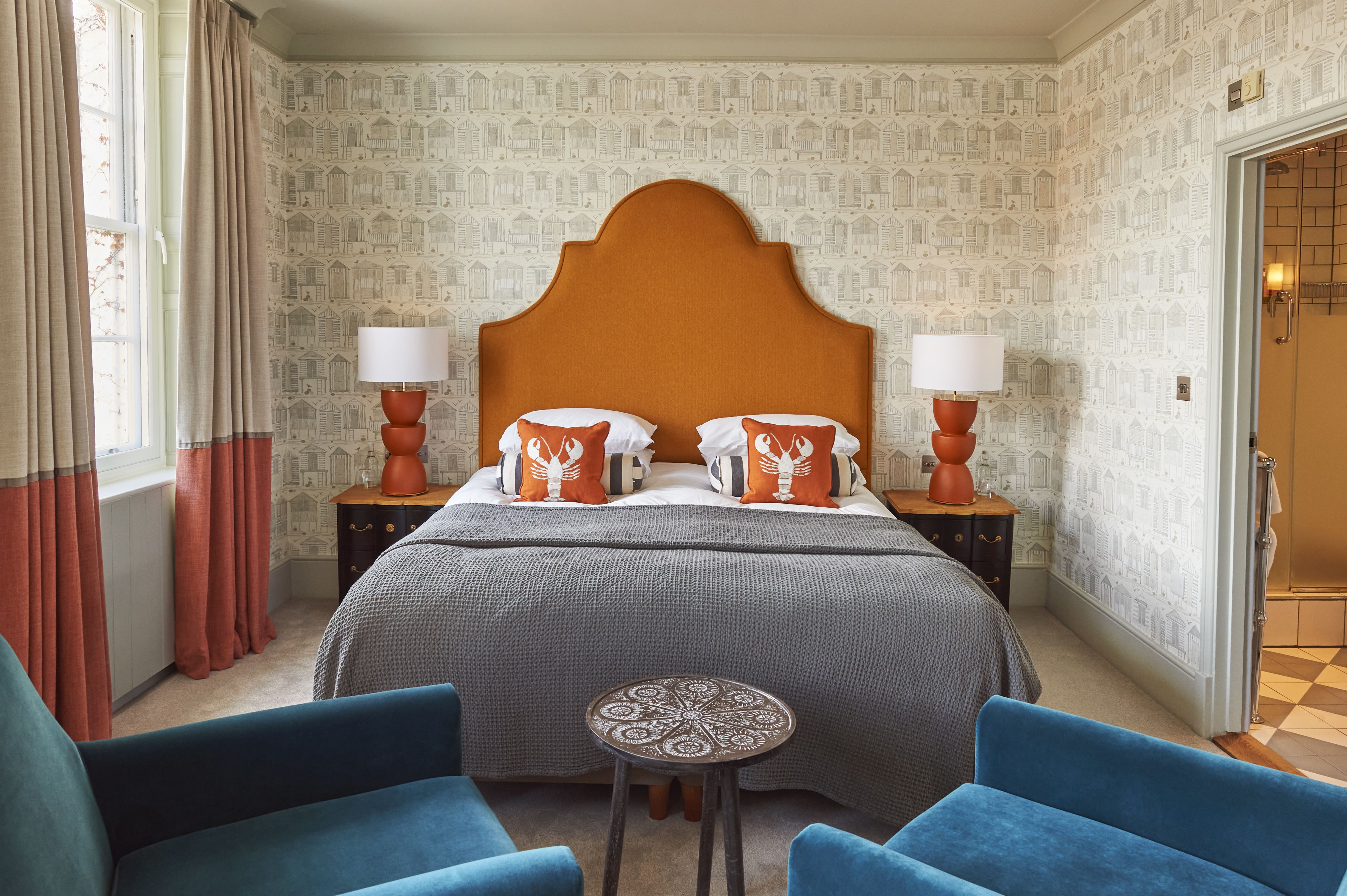 Bed and two chairs in the deluxe room at Hotel du Vin Poole