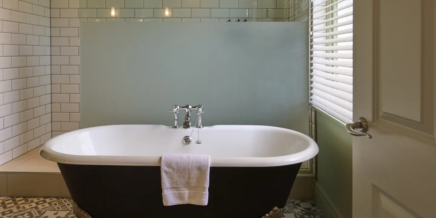 A spacious bathroom with a bathtub and a shower