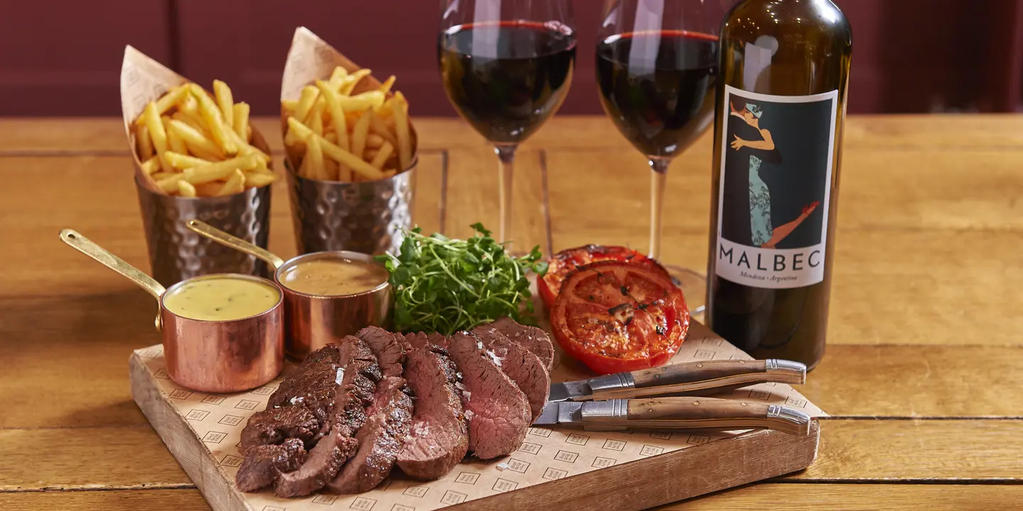 Delicious fries, steak and wine