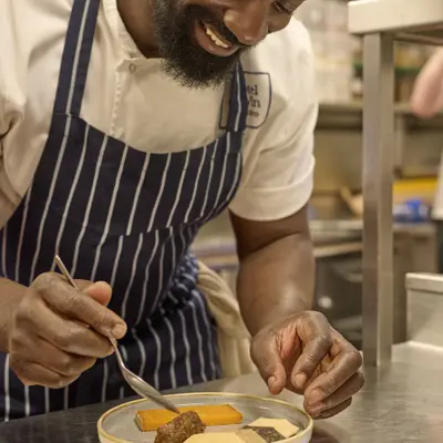 Chef garnishing dish