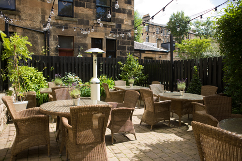Outdoor seating at One Devonshire Gardens
