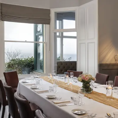 A beautifully arranged table adorned with elegant candles and wine glasses.