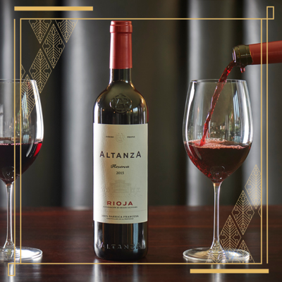 red wine being poured intoa glass