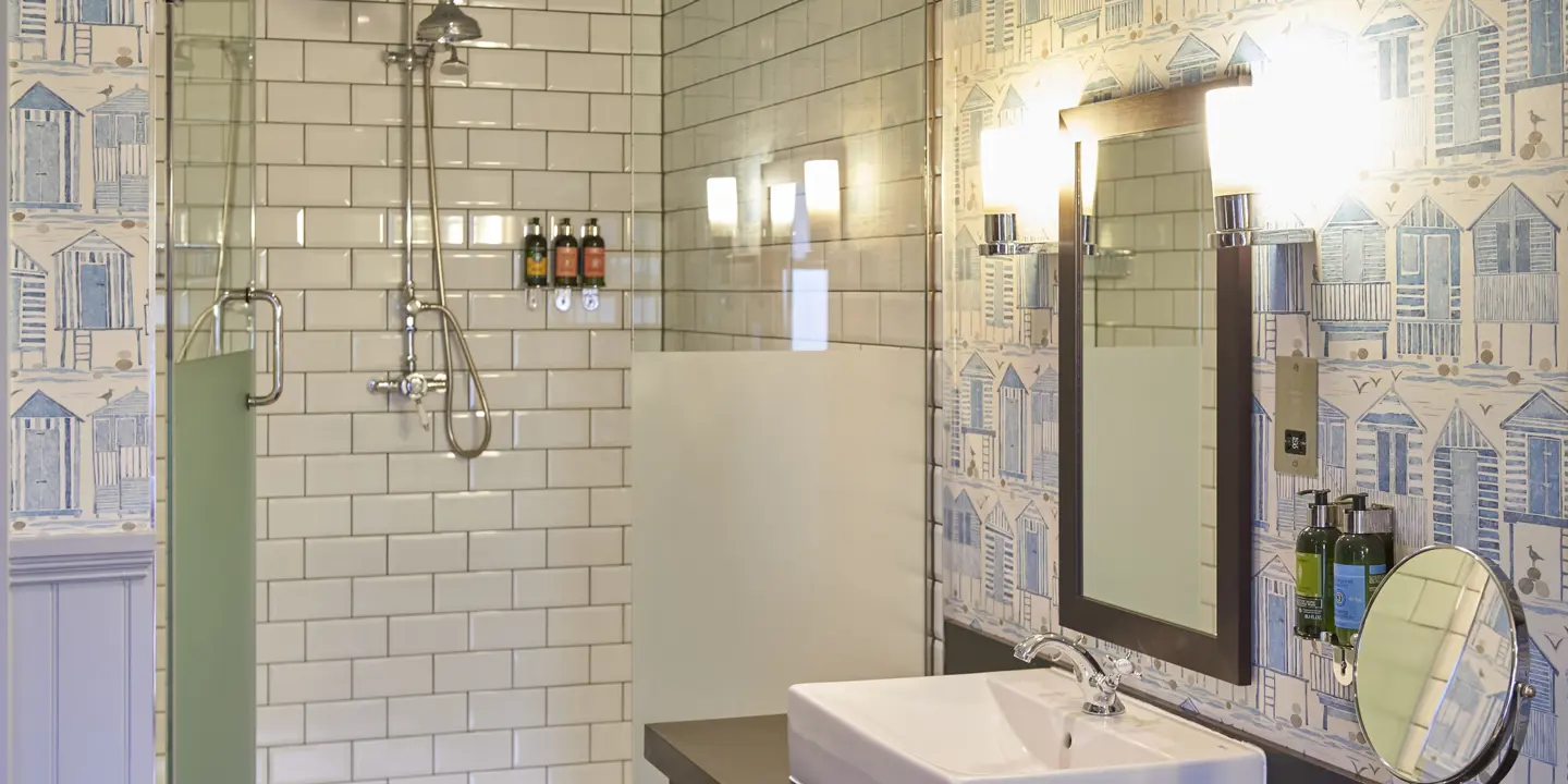 Bathroom featuring a sink and shower.