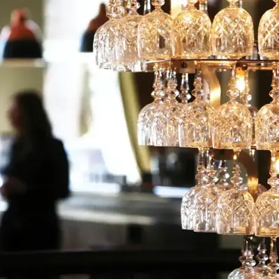 Wine glass chandelier suspended from the ceiling