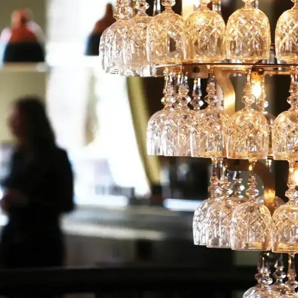 Wine glass chandelier suspended from the ceiling