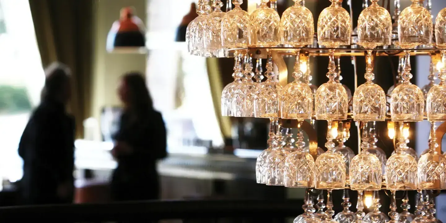 Wine glass chandelier suspended from the ceiling