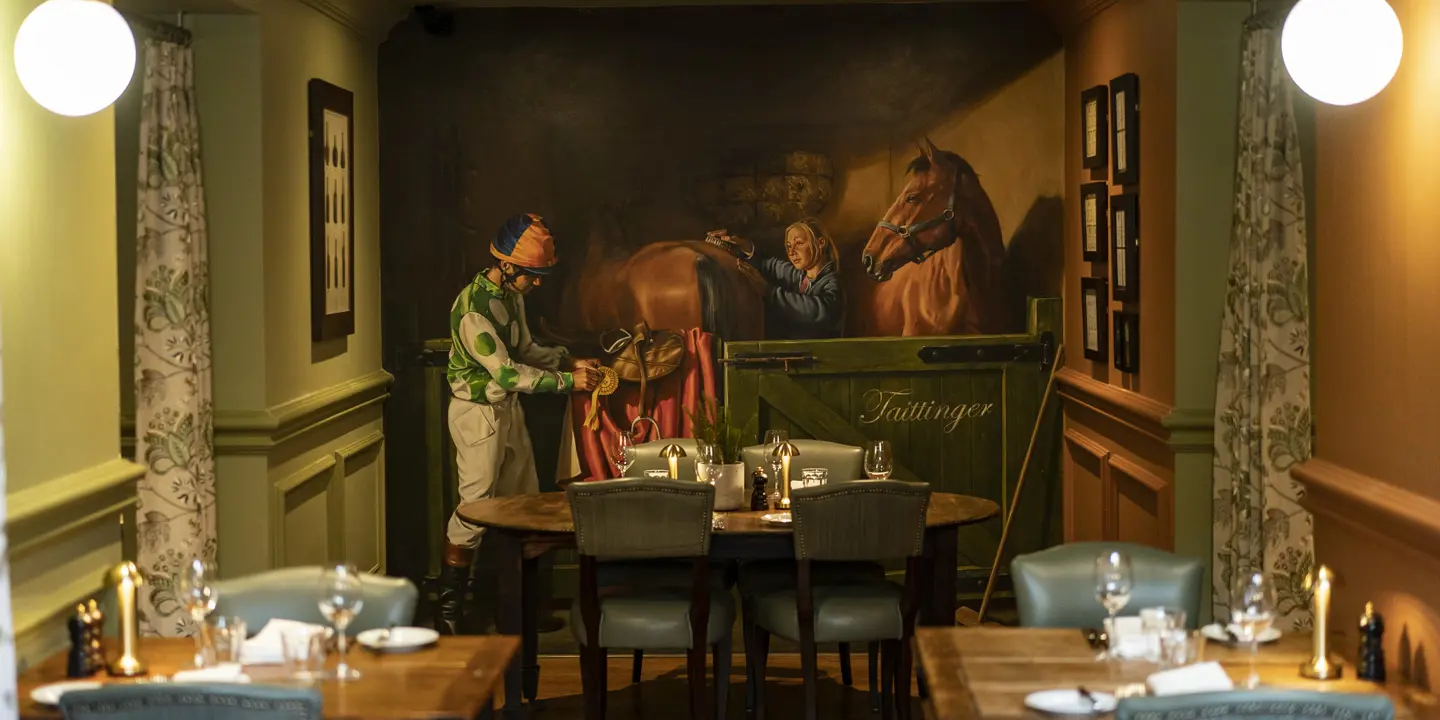 A restaurant featuring tables and chairs, with a captivating painting adorning the wall.