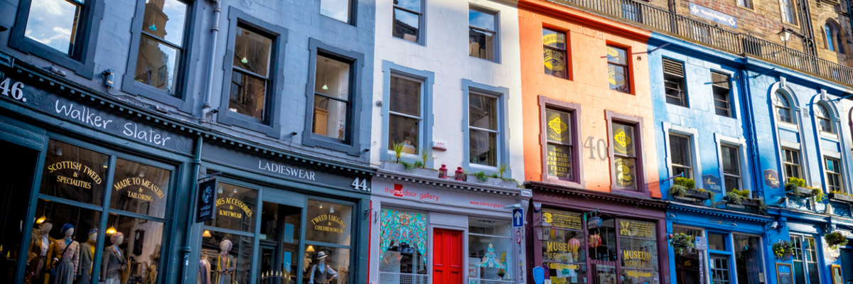 Shops lining a picturesque cobblestone street.