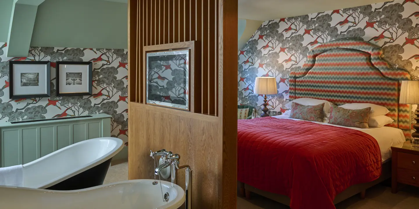 A double bed with a bathtub opposite