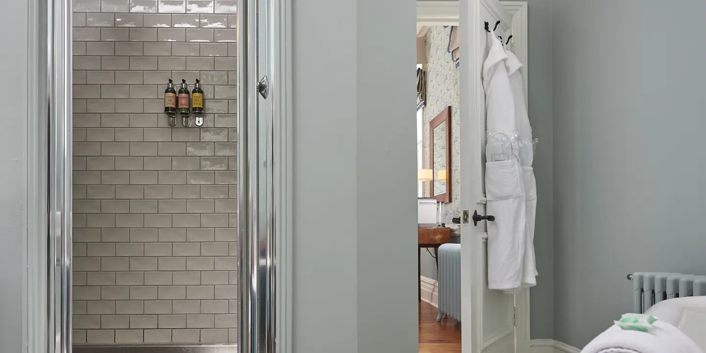 A bathroom featuring a walk-in shower adjacent to a bathtub.