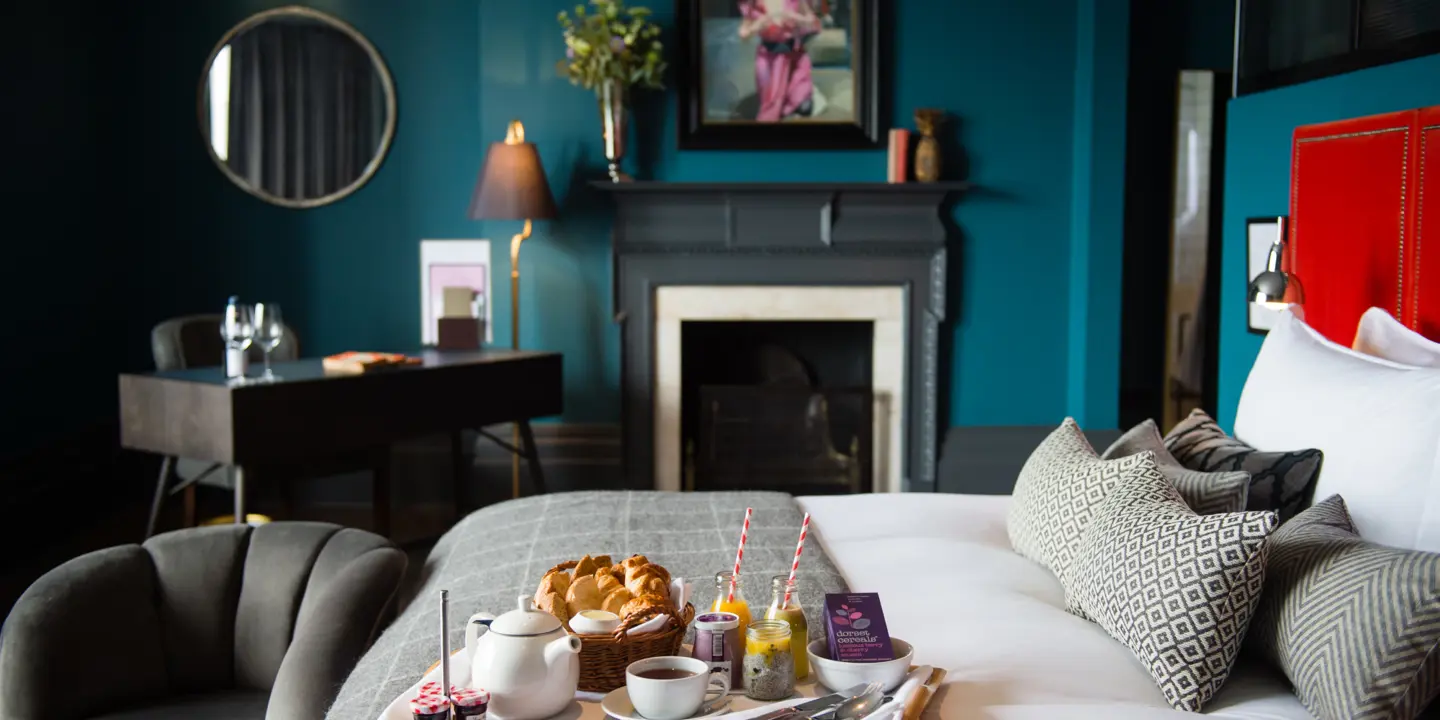 An assortment of food arranged on a bed tray.