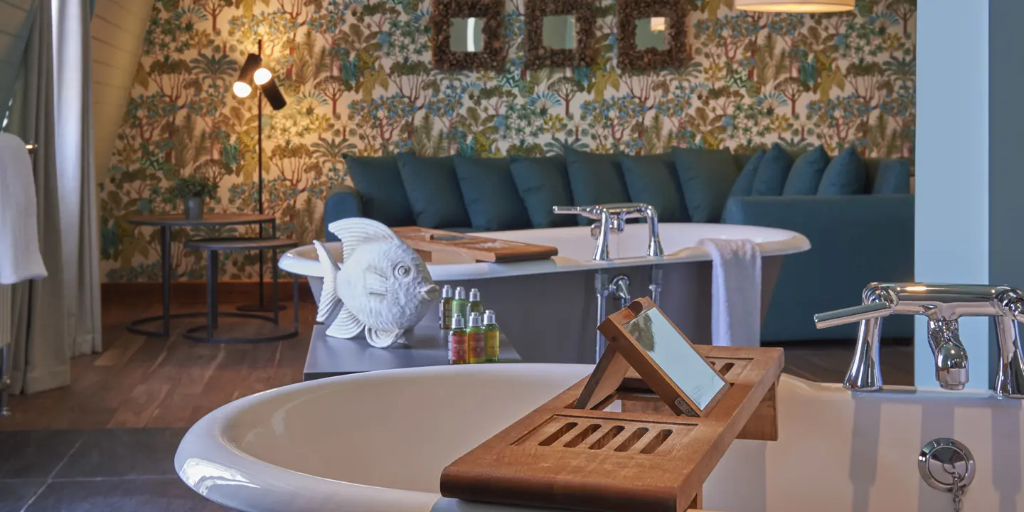 A bathtub with a wooden tray inside.