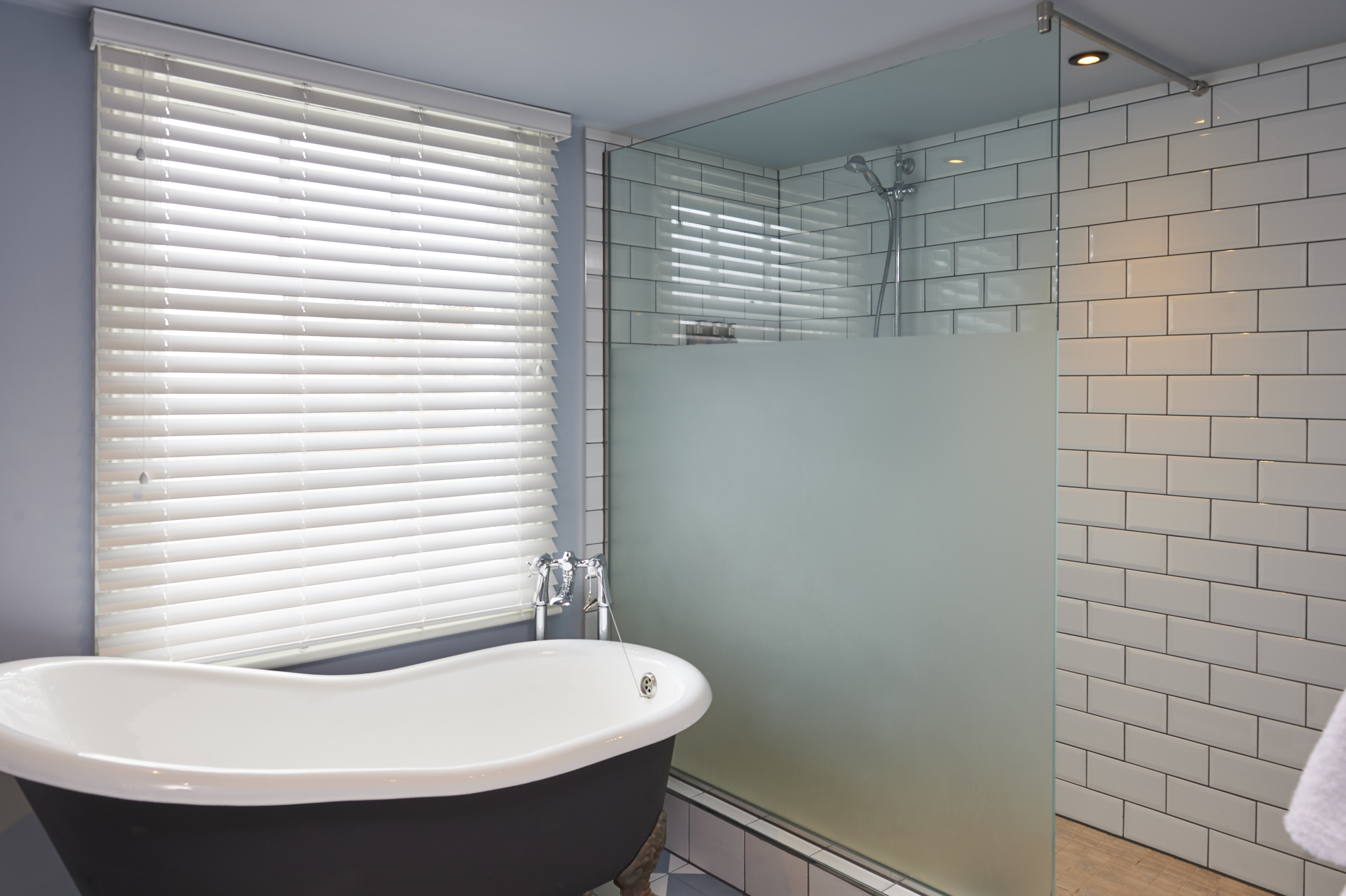 Bathroom featuring a bathtub and shower