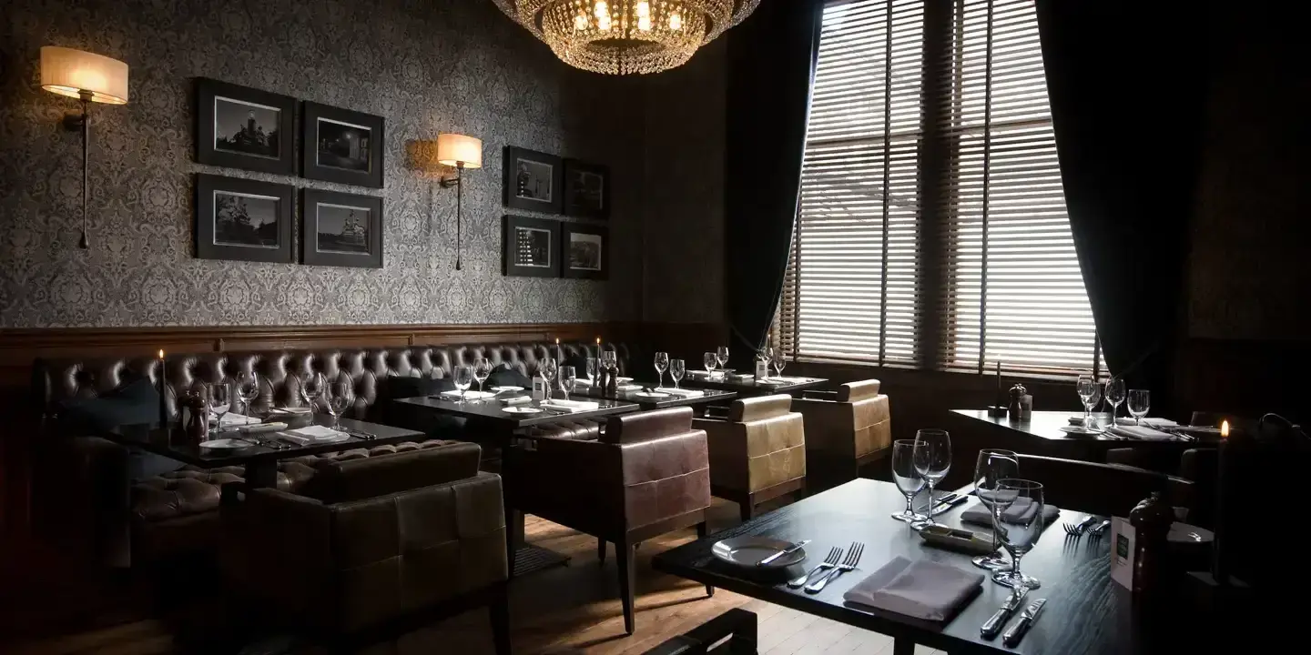 A spacious dining room filled with numerous tables and chairs.