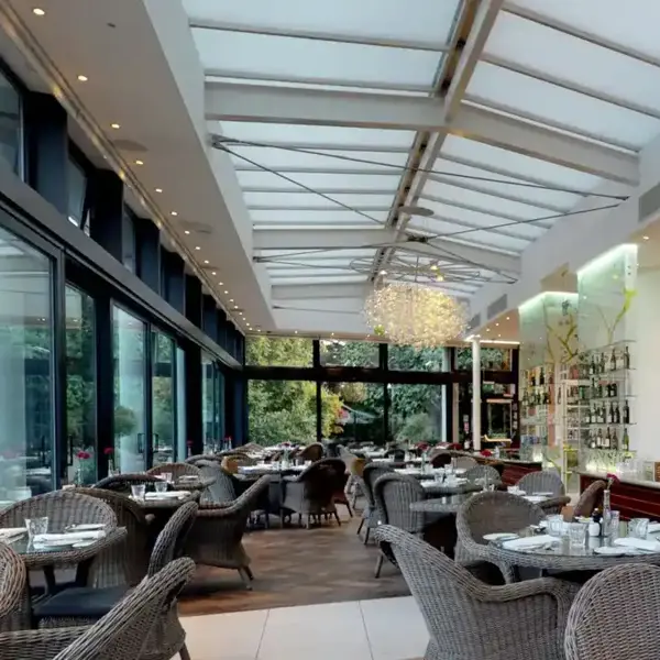 A restaurant featuring numerous tables and chairs.