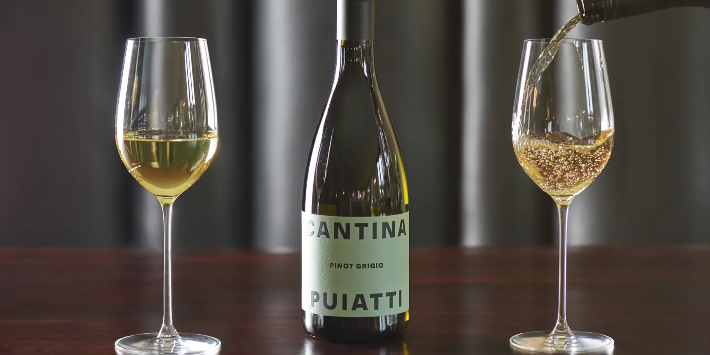 Pouring white wine into glass