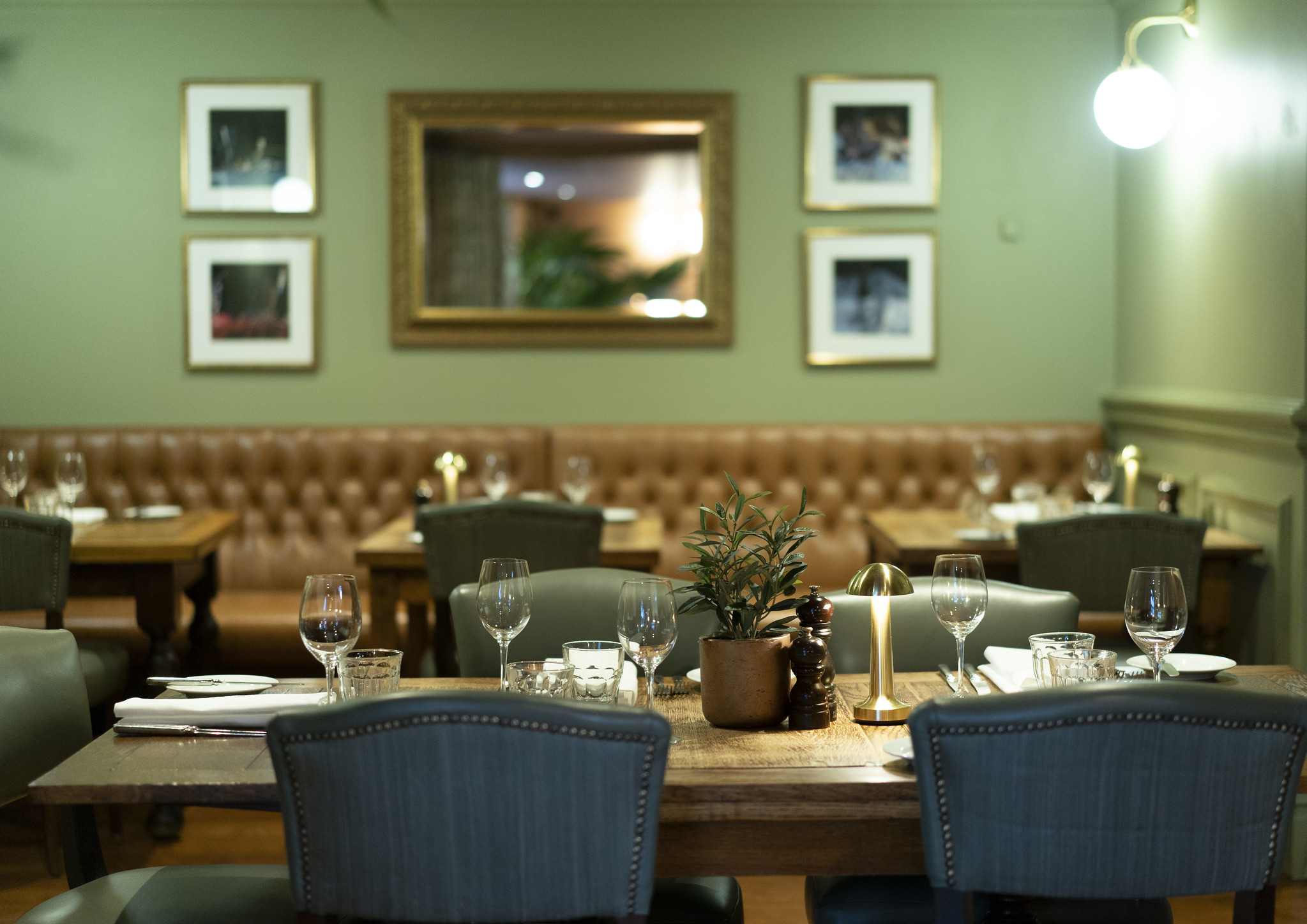 A dining room featuring a wooden table and chairs.