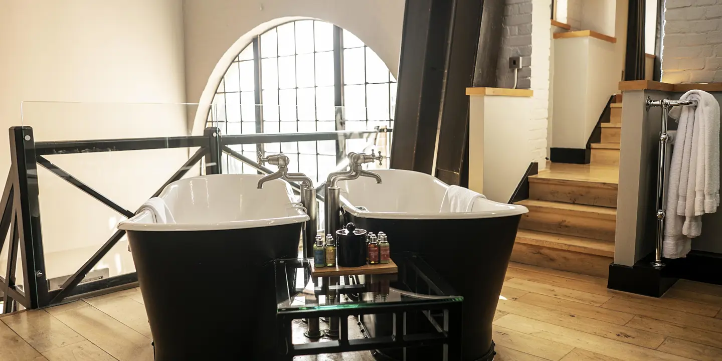 Bathroom with a bathtub placed alongside a sink