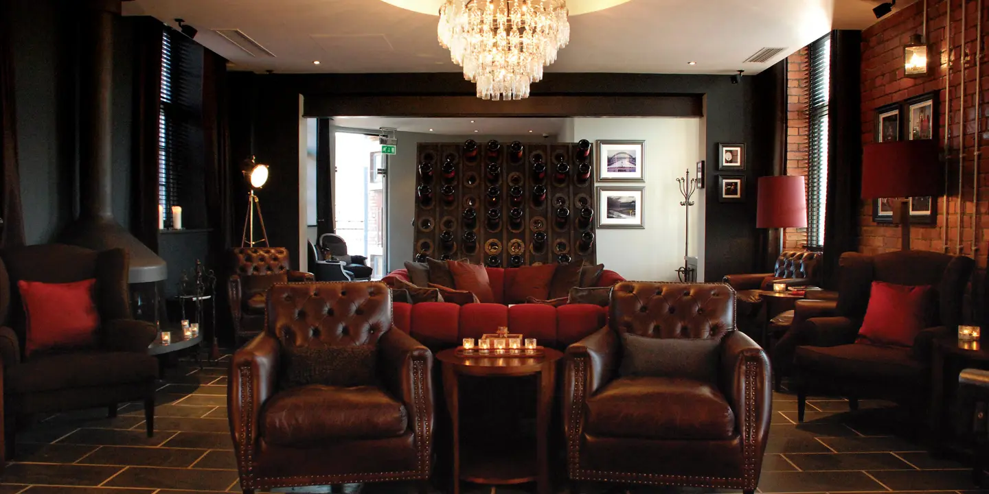 An elegantly furnished living room with a stunning chandelier.