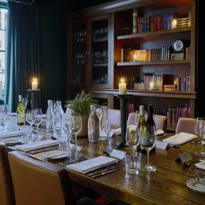 A beautifully arranged dining table with elegantly set place settings.