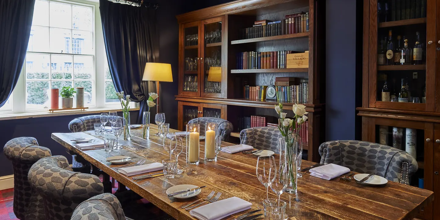 A beautifully arranged dining table with elegantly set place settings.